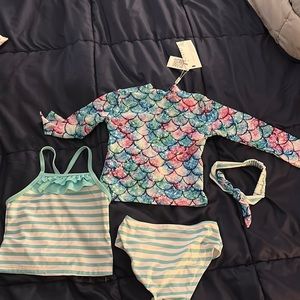 18 month old 4 piece bathing suit. Mix and match with headband. NWT